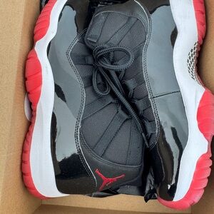Air Jordan Black and Red Sneakers 11s